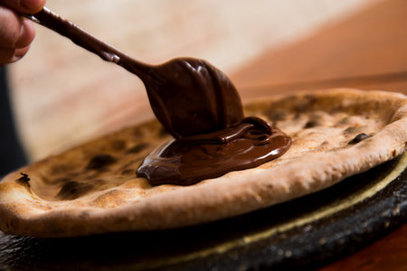 Chocolate Pizza. Neapolitan pizza made with chocolate cream. Italian recipe.の写真素材