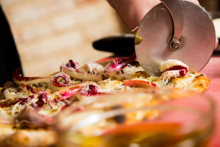 Neapolitan pizza with guanciale, pecorino and radicchio. Classic Italian recipe.の写真素材