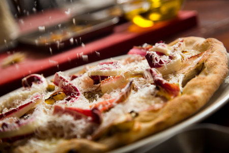 Neapolitan pizza with guanciale, pecorino and radicchio. Classic Italian recipe.の写真素材