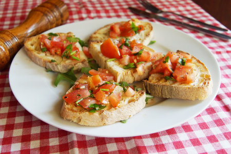 Bruschetta is an antipasto from Italy consisting of grilled bread rubbed with garlic and topped with...