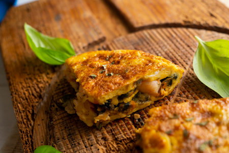 Spanish potato omelette with prawns. Traditional tapa recipe with egg, potato, onion.