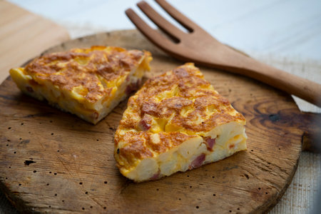 Spanish potato omelette with cauliflower. Traditional tapa recipe with egg, potato, onion.の写真素材