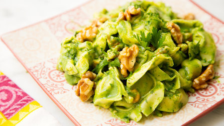 Pasta with pesto. Pesto is a typical seasoning or sauce originating from Liguria. Its main ingredient is basil or better, Genovese basil.の写真素材