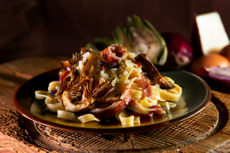 Spaghetti with fried artichoke, Serrano ham and Parmesan cheese.の写真素材