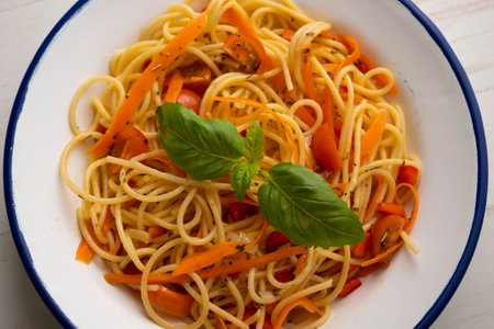 Spaghetti with sautÃ©ed carrot and basil. Vegan pasta recipe.の写真素材