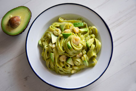 Noodles with avocado cream and prawns.の写真素材