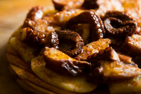 Galician octopus. Octopus cooked with boiled potato, paprika and olive oil. Galician recipe north of...