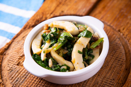 Grilled cuttlefish with chard. Traditional Spanish cover.の写真素材