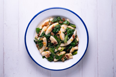 Grilled cuttlefish with chard. Traditional Spanish cover.の写真素材