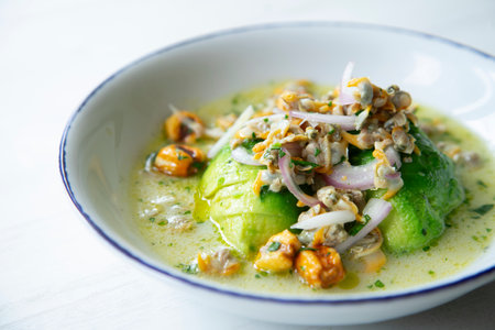Cockle ceviche with toasted corn and avocado.