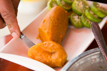Preparing a delicious Peruvian sea bass ceviche in the fishing port of Chorios in Lima.の写真素材