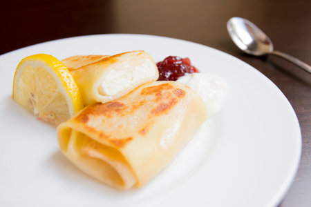 A blini, or sometimes blin, is a Russian and more broadly Eastern European pancake that is traditionally made from buckwheat or wheat flour today and served with smetana, tvorog...の写真素材