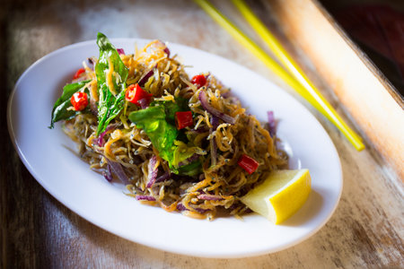 Tiny fried fish salad. Traditional Asian salad recipe.の写真素材