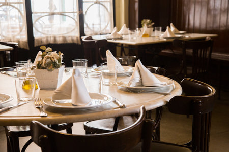 Elegant restaurant table with cutlery, crockery and glasses.の写真素材