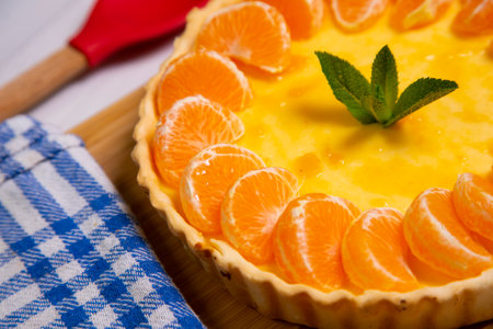 Mandarin cheesecake with pieces of fresh fruit.の写真素材