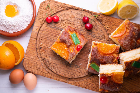 Coca de Sant Joan. Traditional San Juan cake to celebrate the arrival of summer in Spain made with brioche bread, candied fruit and nuts.の写真素材