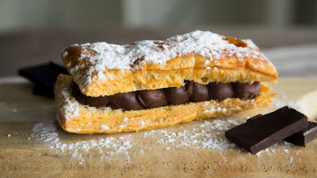 Delicious French dessert made with puff pastry filled with chocolate cream