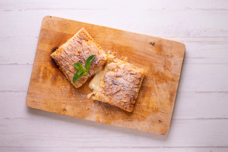 Delicious French dessert made with puff pastry filled with nuts and raisins.の写真素材