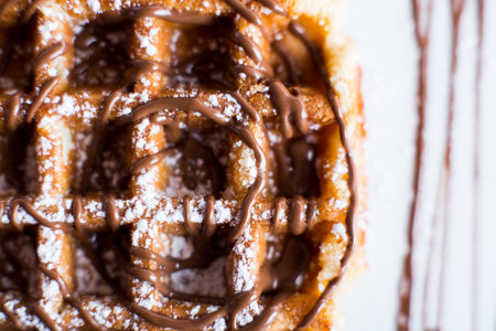 A waffle, also cited with the foreign words waffle, wafol, wafel or waffle, is a typical Belgian and northern French breakfast.の写真素材