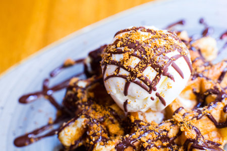 A waffle, also cited with the foreign words waffle, wafol, wafel or waffle, is a typical Belgian and northern French breakfast.の写真素材