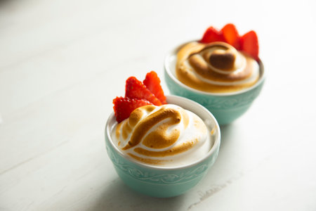 Baked meringue with strawberries and egg.の写真素材