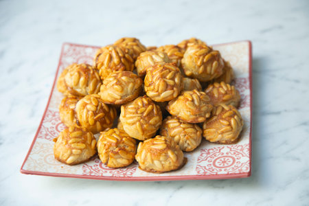 <p>Penellets. Small sweets of various shapes, made from almond and potato dough, and covered with almonds or pine nuts.</p>の写真素材