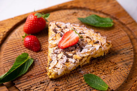 <p>Almond cake with chocolate shavings and strawberry pieces.</p>の写真素材