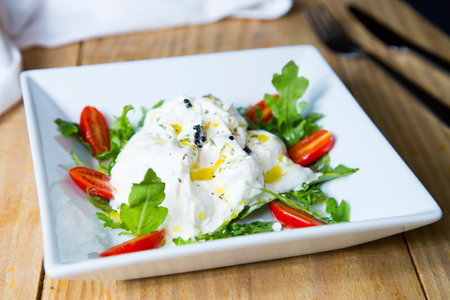 Burrata salt. The burrata is a fresh cow's milk cheese, with spun paste and round in shape, with an...