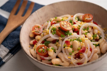 White bean salad with onion and tomato.の写真素材