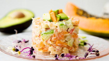 Delicious salad with mayonnaise, avocado and carrot.の写真素材