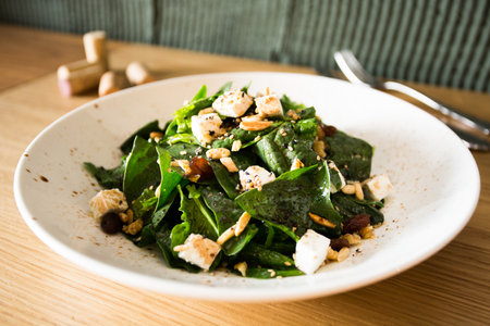 Spinach salad with cheese and nuts.の写真素材