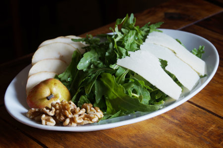 Delicious salad fresh ingredients, tomatoes and arugula.の写真素材