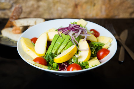 Delicious and healthy salad with apple and other vegetablesの写真素材