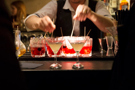 Bartender preparing cocktails in a martini glass.の写真素材