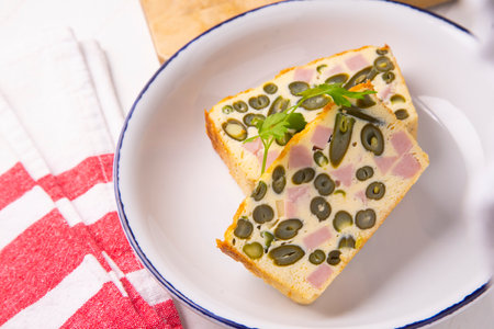 Egg pudding, green beans and baked ham.の写真素材