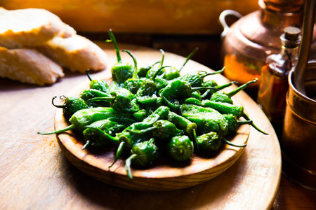 Fried green padron peppers. Traditional Spanish cover.の写真素材