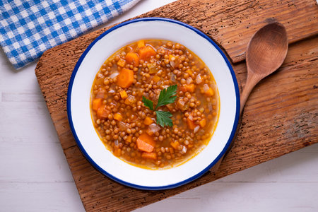 Lentil dish with potato, chorizo and black pudding. Traditional Spanish lentil stew with vegetables.の写真素材