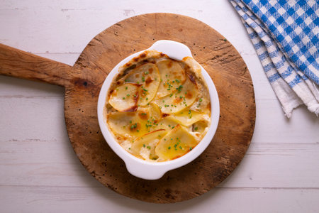 Baked potato slices gratin. Traditional Spanish recipe.の写真素材