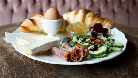 Plate with toast and ham at breakfast timeの写真素材