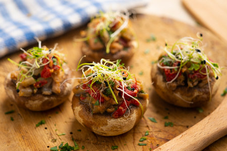 Baked mushrooms stuffed with tuna and paprika. Traditional Spanish cover.の写真素材