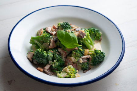 Broccoli cooked with cream Italian carbonara style with bacon.の写真素材