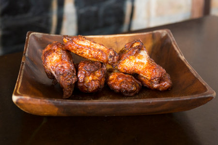 Plate with Kentucky style fried chicken wings.の写真素材