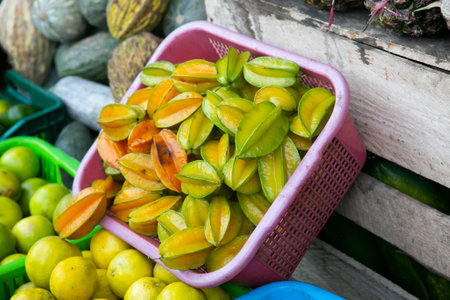 Asterisa or star fruit is the fruit of the averrhoa carambola tree native to Indonesia, the Philippines and Malaysia.の写真素材