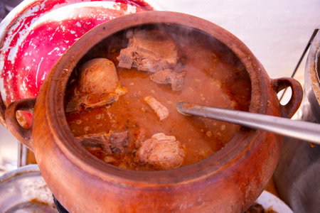 The Adobo de Chancho arequipeÃ±o consists of a marinated pork meat dish that is accompanied by vegetables and seasonings cooked in a clay pot..の写真素材