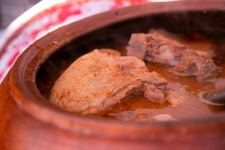 The Adobo de Chancho arequipeÃ±o consists of a marinated pork meat dish that is accompanied by vegetables and seasonings cooked in a clay pot..の写真素材