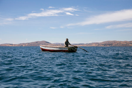 Activity of fishermen and their boats in the LlachÃ³n peninsula on Lake Titicaca.の写真素材