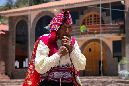 Taquile, Peru; 1st January 2023: Locals from the island of Taquile in Peru dancing and playing music...