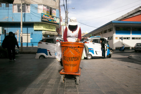 Puno, Peru, 1st January 2023; Woman selling "Ice cream cheese" in the street, the traditional ducle of the city of Arequipa.のeditorial素材
