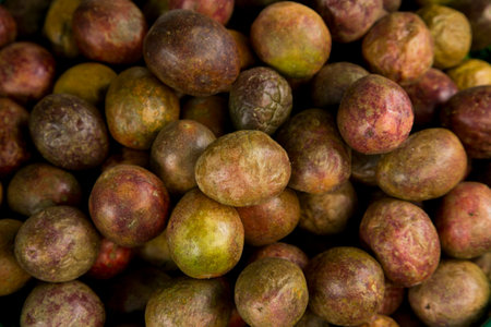 Passion fruits in a fruit stand at Klong Toei market in Bangkok.の写真素材