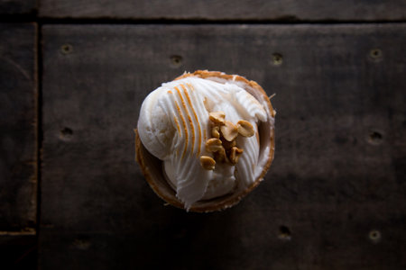Coconut ice cream served in a coconut shell in Amphawa floating Market, Thailand.の写真素材